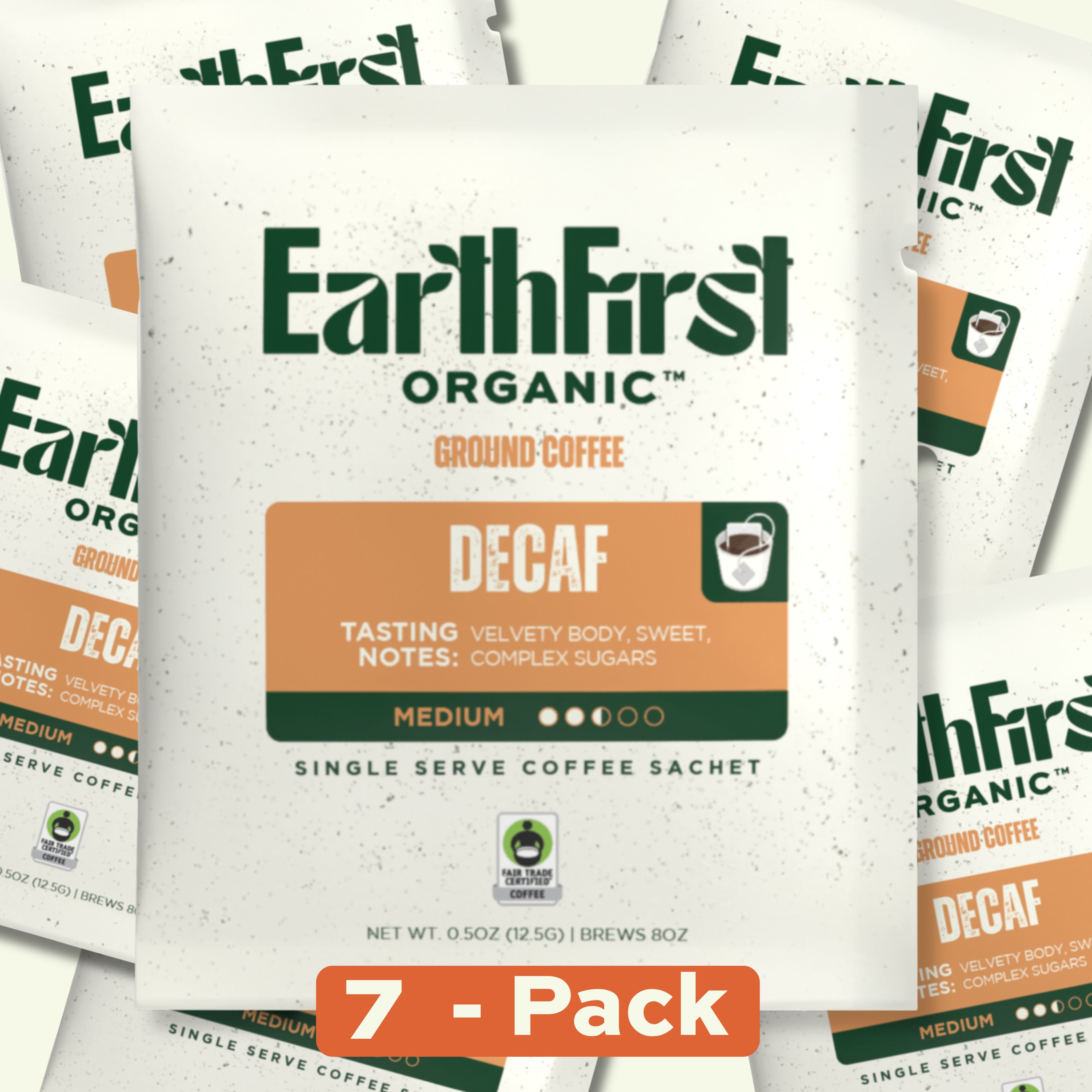 Seven EarthFirst Organic Swiss Water Process Decaf Coffee single sachets arranged in a display, showcasing the product packaging.