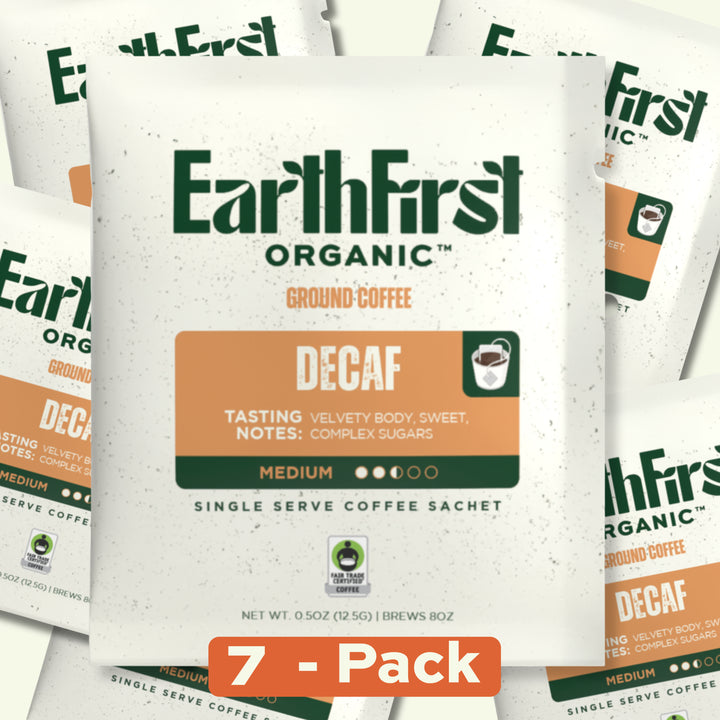 Seven EarthFirst Organic Swiss Water Process Decaf Coffee single sachets arranged in a display, showcasing the product packaging.