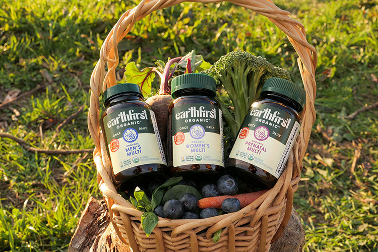 EarthFirst Organic supplements in a basket of fresh produce